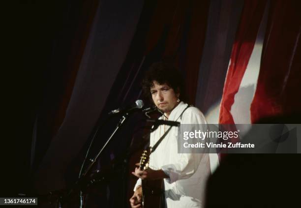American singer-songwriter Bob Dylan performs at the Live Aid benefit concert, held at the John F Kennedy Stadium in Philadelphia, Pennsylvania, 13th...