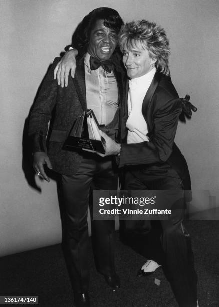 American singer and musician James Brown and British singer and songwriter Rod Stewart attend the 3rd Annual American Video Awards, held at the Santa...