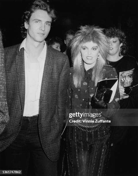 American musician and songwriter Neil Giraldo and his wife, American singer and songwriter Pat Benatar attend the 1985 MTV Video Music Awards, held...