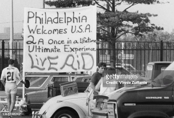 Banner reading 'Philadelphia welcomes USA 2 a once in a lifetime ultimate experience' a reference to the city hosting the Live Aid benefit concert,...