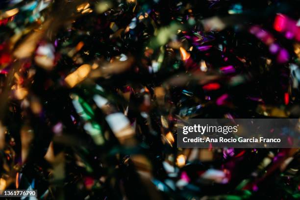 abstract dark multi colored confetti background - pink glitter confetti stock pictures, royalty-free photos & images