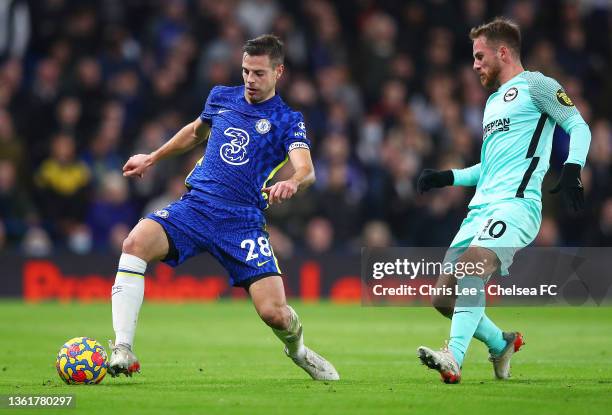 Cesar Azpilicueta of Chelsea battles for possession with Alexis Mac Allister of Brighton & Hove Albion during the Premier League match between...