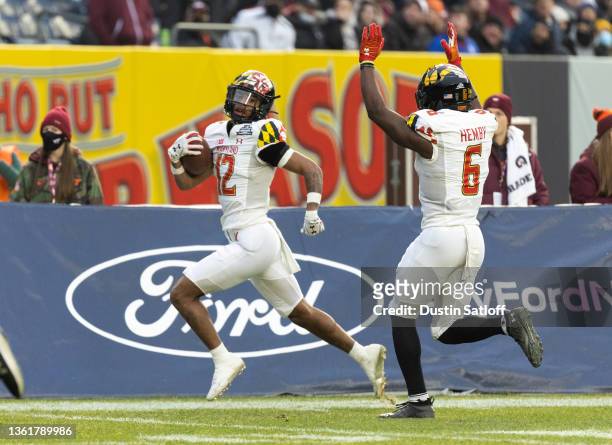 Tarheeb Still of the Maryland Terrapins returns a punt for a touchdown during the first quarter of the New Era Pinstripe Bowl against the Virginia...