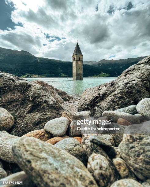 reschensee - lake reschen - bolzano stock pictures, royalty-free photos & images