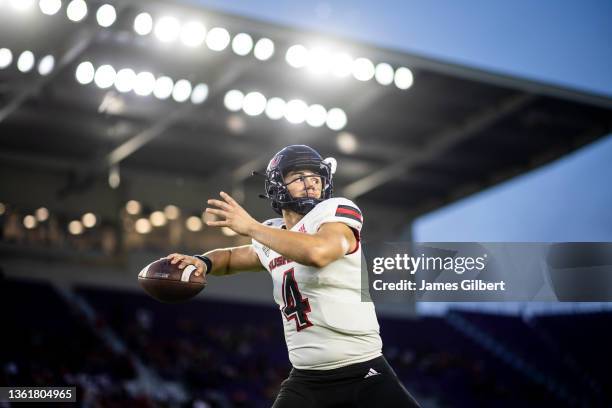 Dustin Fletcher of the Northern Illinois Huskies warms up before the start of the 2021 Cure Bowl against the Coastal Carolina Chanticleers at...