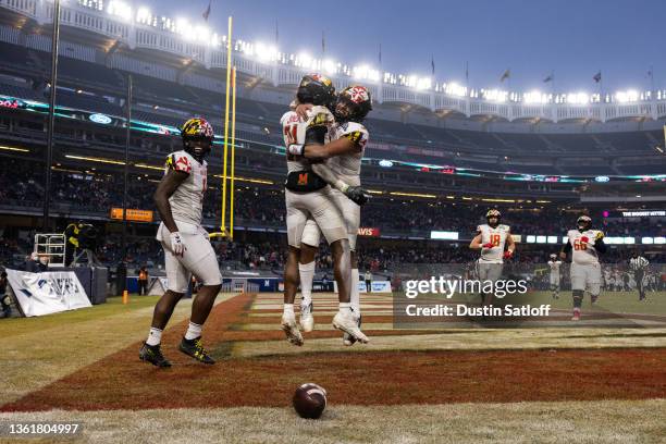 Taulia Tagovailoa and Darryl Jones of the Maryland Terrapins celebrate a touchdown during the third quarter of the New Era Pinstripe Bowl against the...