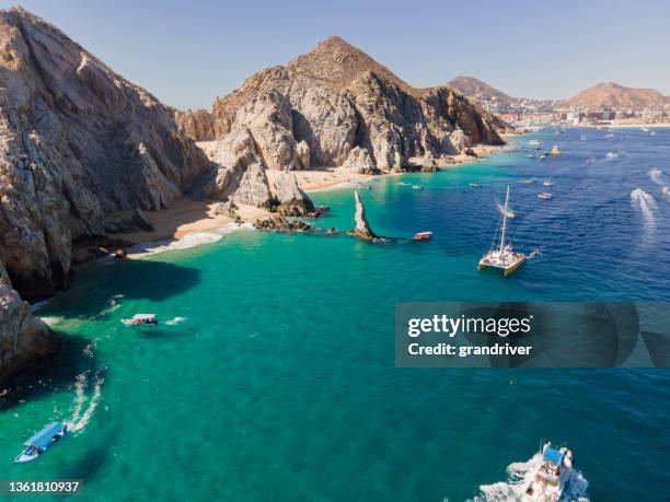 aerial view looking down at the famous rock formations and arch of cabo san lucas, baja california sur, mexico darwin arch glass-bottom boats viewing sea life - sea of cortes stock pictures, royalty-free photos & images