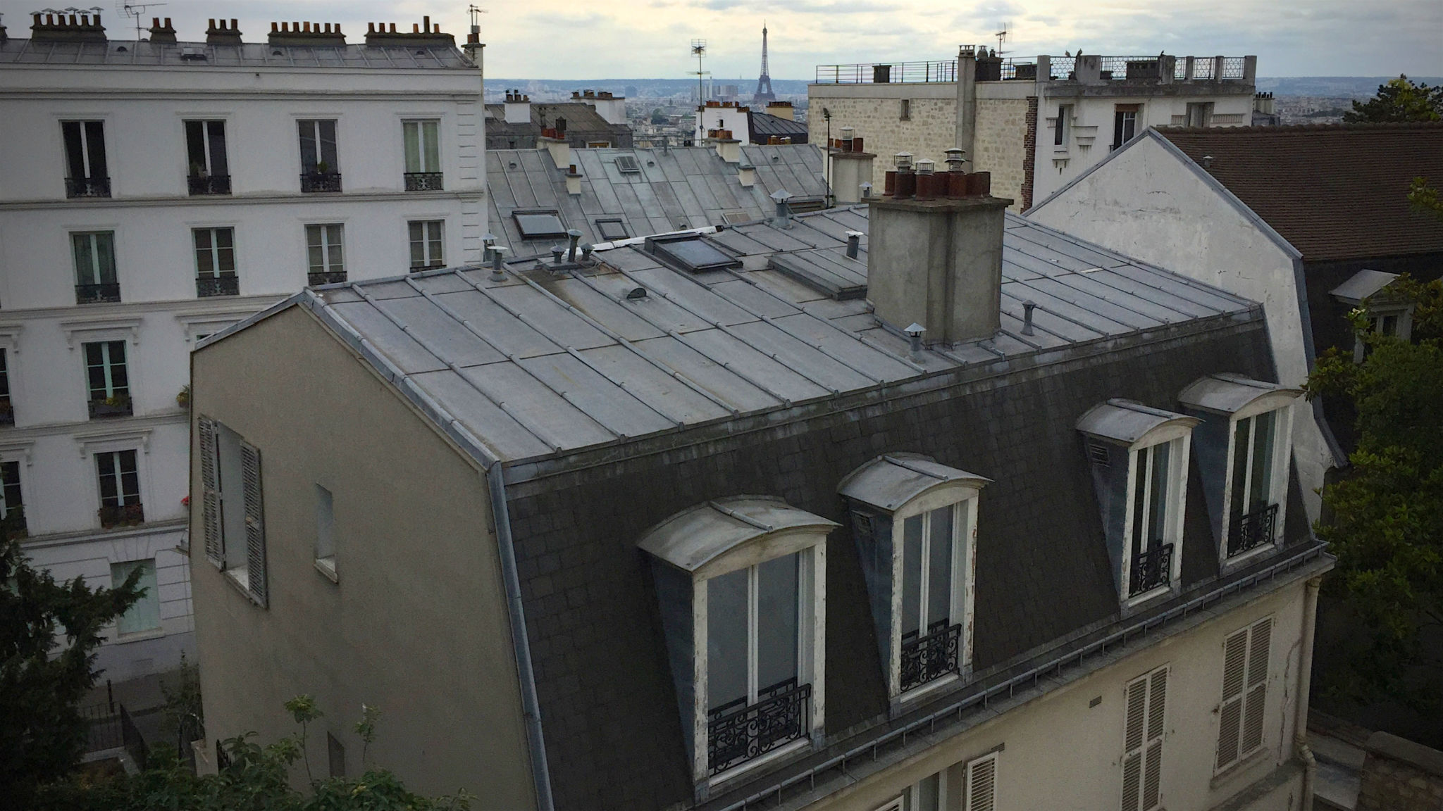 Eiffel Tower among rooftops, Paris Eiffel Tower among rooftops, Paris