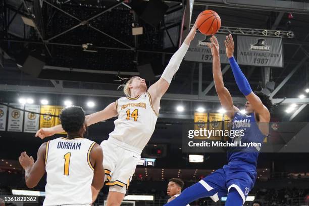 Noah Horchler of the Providence Friars blocks a shot by Jared Rhoden of the Seton Hall Pirates in the second half at the Dunkin' Donuts Center on...