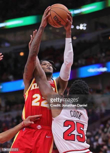 Cam Reddish of the Atlanta Hawks is fouled by Tyler Cook of the Chicago Bulls at the United Center on December 29, 2021 in Chicago, Illinois. NOTE TO...