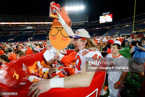 Luke Price and Bryan Bresee of the Clemson Tigers celebrate after defeating the Iowa State Cyclones in the Cheez-It Bowl Game at Camping World...