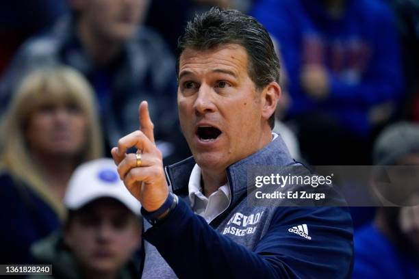 Head coach Steve Alford of the Nevada Wolf Pack gestures as he talks to an official after a foul in the first half at Allen Fieldhouse on December...