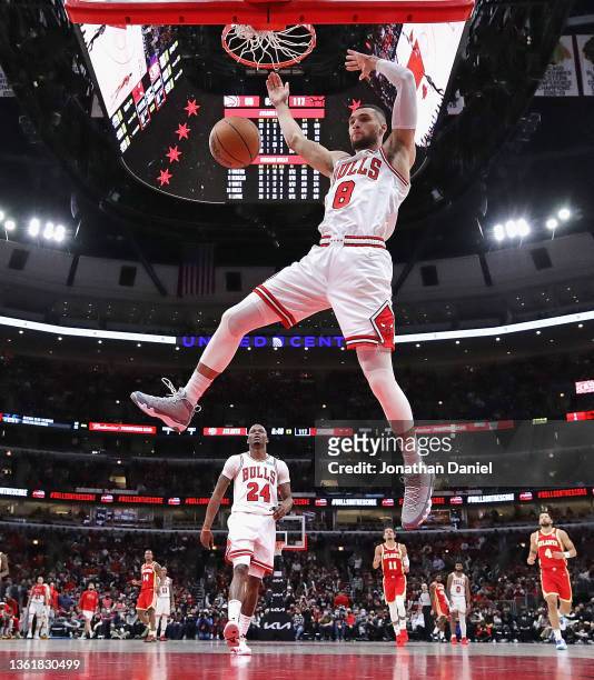 Zach LaVine of the Chicago Bulls dunks against the Atlanta Hawks at the United Center on December 29, 2021 in Chicago, Illinois. The Bulls defeated...
