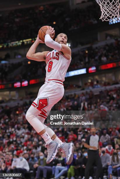 Zach LaVine of the Chicago Bulls goes up for a dunk against the Atlanta Hawks at the United Center on December 29, 2021 in Chicago, Illinois. The...