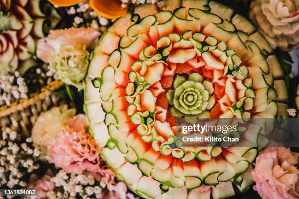 carved watermelon with flora patterns - thai fruit carving stock pictures, royalty-free photos & images