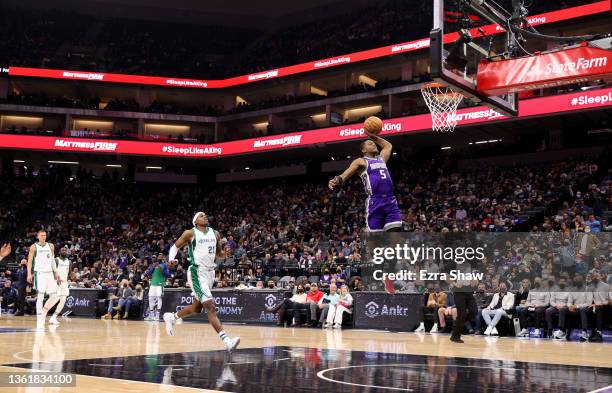 De'Aaron Fox of the Sacramento Kings goes up for a dunk against the Dallas Mavericks in the first half at Golden 1 Center on December 29, 2021 in...