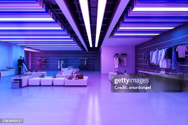 clothing store with clothes, shoes, other personal accessories and neon lights - design interieur stock pictures, royalty-free photos & images