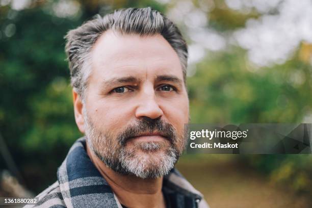 portrait of mature man in back yard - only mature men fotografías e imágenes de stock