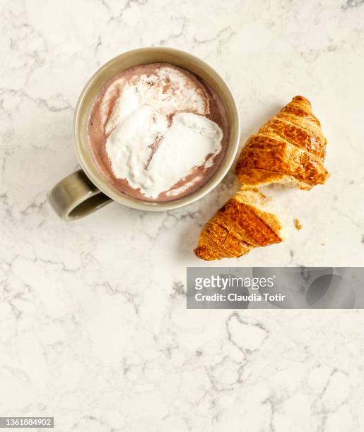 cup of hot chocolate with marshmallow and a croissant on white, marble background - croissant white background imagens e fotografias de stock