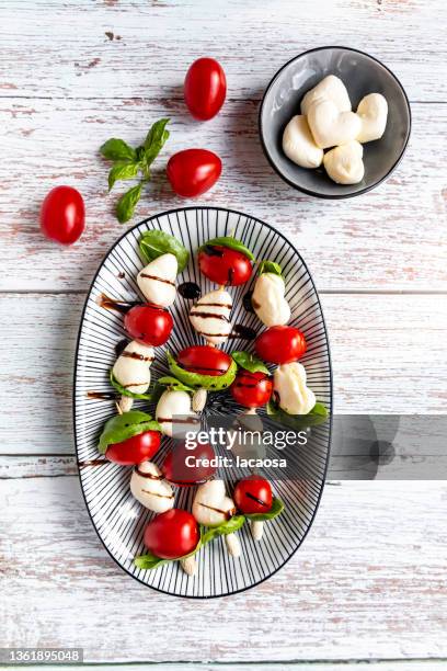 heart shaped mozzarella and cherry tomato skewers - balsamic vinegar stock pictures, royalty-free photos & images