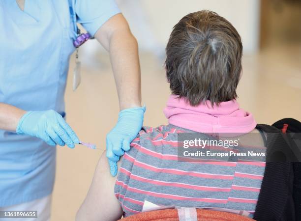 Person receives a vaccine against Covid-19, at the Infanta Sofia Hospital, on 30 December, 2021 in San Sebastian de los Reyes, Madrid, Spain. The...