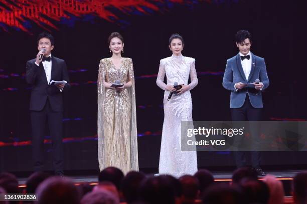 Actor Deng Chao, TV hostess Lan Yu, actress Li Bingbing and actor Huang Xiaoming stand on the stage during the closing ceremony of the 30th China...