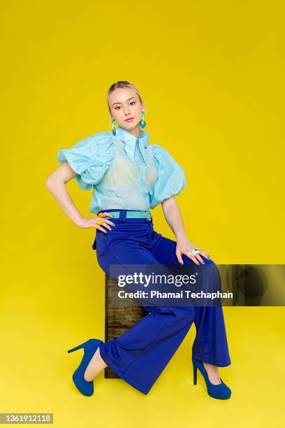 fashionable woman dresses in blue - flared trousers stock pictures, royalty-free photos & images