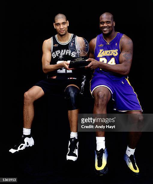 Shaquille O'Neal of the Los Angeles Lakers and Tim Duncan of the San Antonio Spurs pose for a portrait with the MVP award after being chosen...