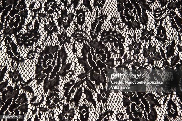 elegant black lace on a white fabric lining - encaje fotografías e imágenes de stock