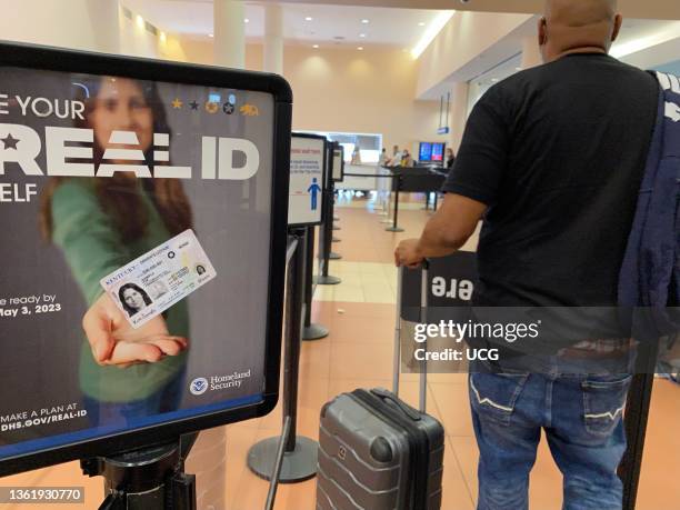 Homeland Security sign for REAL ID at entrance to passenger TSA security area, West Palm Beach, Florida.