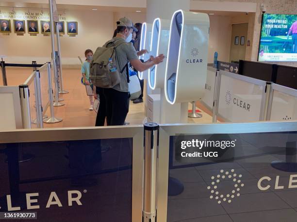 Passengers using CLEAR kiosk that allows quick and secure Identity confirmation, West Palm Beach Airport, Florida.