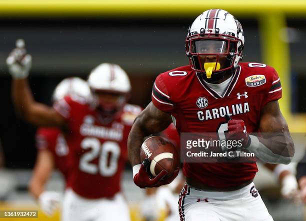 Jaheim Bell of the South Carolina Gamecocks carries the ball for a touchdown following a reception during the first quarter of the Duke's Mayo Bowl...