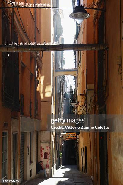 Typical ligurian narrow street on December 28, 2011 in Genoa, Italy. Genoa is the capital of the region Liguria and has the largest seaport in Italy....