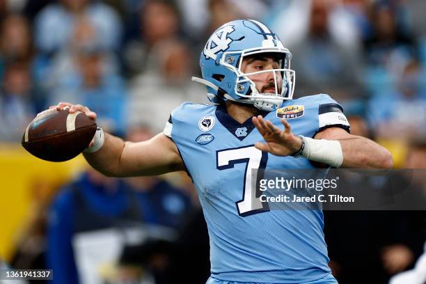 Sam Howell of the North Carolina Tar Heels looks to pass during the first half of the Duke's Mayo Bowl against the South Carolina Gamecocks at Bank...