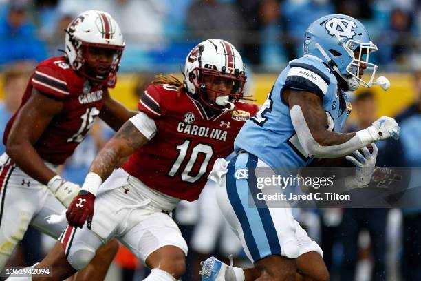 British Brooks of the North Carolina Tar Heels carries the ball for a touchdown during the first half of the Duke's Mayo Bowl against the South...