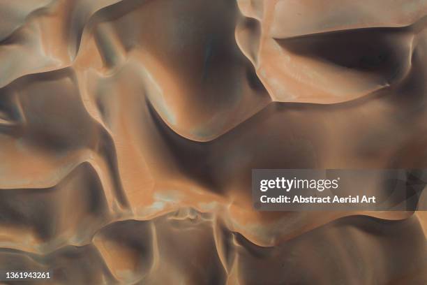 patterns created by desert dunes photographed from above, abu dhabi, united arab emirates - extreme weather desert stock pictures, royalty-free photos & images