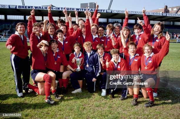 Victorious USA players celebrate with the Womens Rugby Union World Cup Trophy after their victory in the Final against England played at Cardiff Arms...