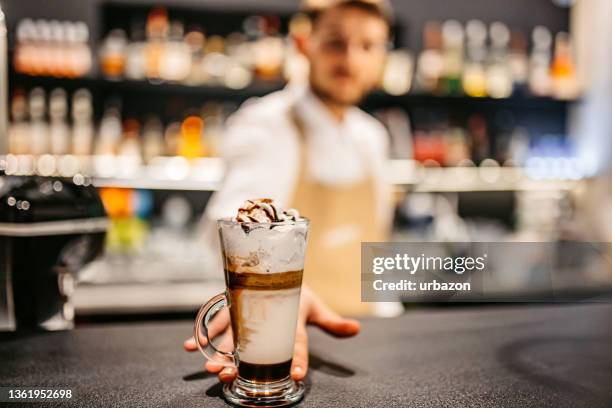 bartender making frappuccino with whipped cream - whipped food stock pictures, royalty-free photos & images