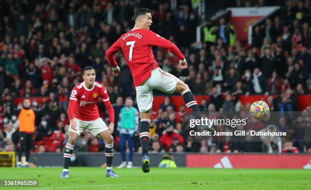 Cristiano Ronaldo of Manchester United scores their third goal during the Premier League match between Manchester United and Burnley at Old Trafford...