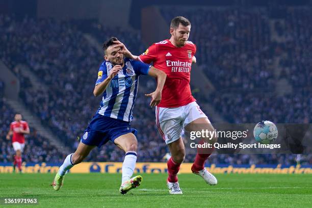 Jan Vertonghen of SL Benfica competes for the ball with Joao Mario of FC Porto during the Liga Portugal Bwin match between FC Porto and SL Benfica at...