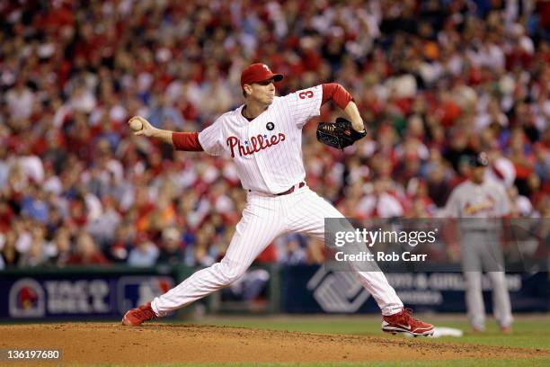 Roy Halladay of the Philadelphia Phillies throws a pitch against the St. Louis Cardinals during Game Five of the National League Divisional Series at...