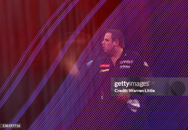 Adrian Lewis of England throws against Wayne Jones of England during Day 11 of the 2012 Ladbrokes.com World Darts Championship at Alexandra Palace on...