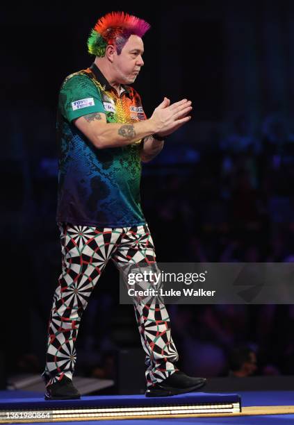 Peter Wright of Scotland reacts to the win during his Fourth Round Match against Ryan Searle of England during Day Thirteen of The William Hill World...