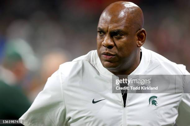 Head Coach Mel Tucker of the Michigan State Spartans looks on before the game against the Pittsburgh Panthers in the Chick-Fil-A Peach Bowl at...
