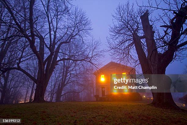 old stone house on foggy night - horror stock pictures, royalty-free photos & images