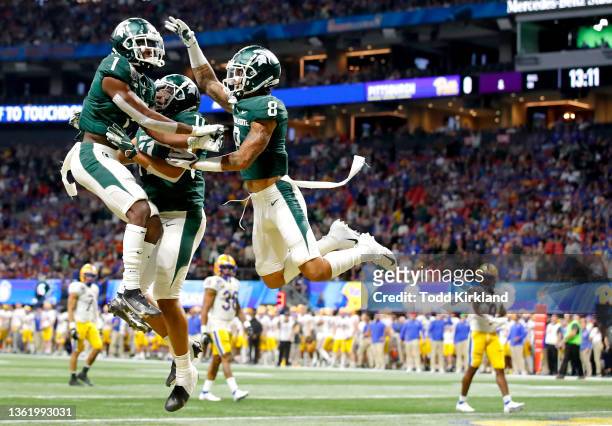 Jayden Reed of the Michigan State Spartans celebrates a touchdown with teammates in the first quarter of the game against the Pittsburgh Panthers...