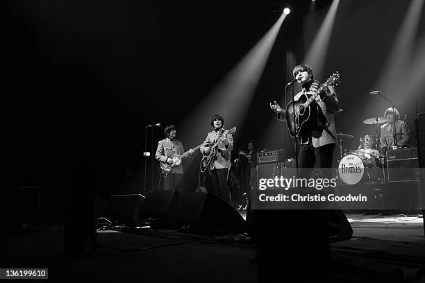 David Catlin-Birch, Andre Barreau, Adam Hastings and Hugo Degenhardt of The Bootleg Beatles perform on stage at the Hammersmith Apollo on December...