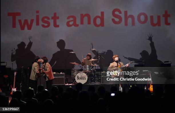David Catlin-Birch, Andre Barreau, Hugo Degenhardt and Adam Hastings of The Bootleg Beatles perform on stage at the Hammersmith Apollo on December...