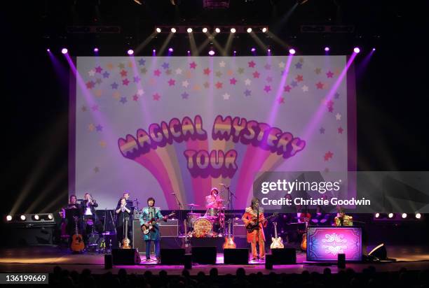 David Catlin-Birch, Hugo Degenhardt, Andre Barreau and Adam Hastings of The Bootleg Beatles perform on stage at the Hammersmith Apollo on December...