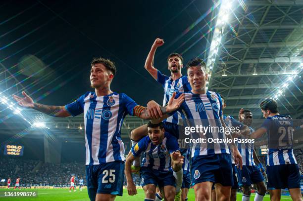 Mehdi Taremi of FC Porto celebrates with teammates after scores his sides third goal during the Liga Portugal Bwin match between FC Porto and SL...